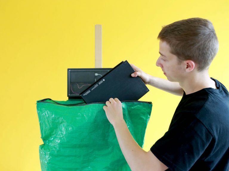 BOXBAG solution in use, inserting a parcel into it